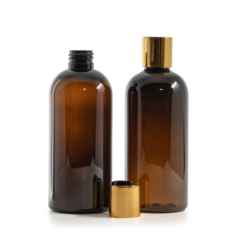 Borostyánszínű műanyag palack fekete disztop kupakkal és aranyszínű alumíniumgyűrűvel, 300 ml
