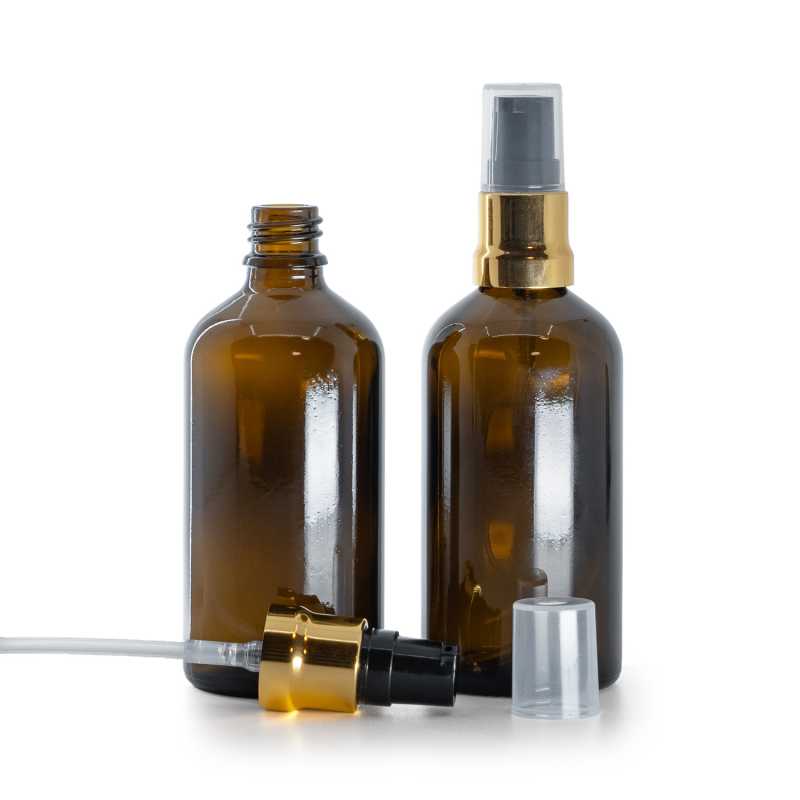 Borostyánszínű üvegpalack fekete-arany fényes pumpával és átlátszó kupakkal, 100 ml