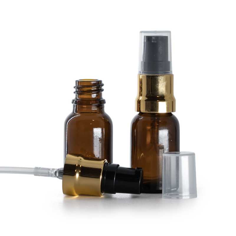 Borostyánszínű üvegpalack fényes fekete-arany adagolóval és átlátszó kupakkal, 15 ml