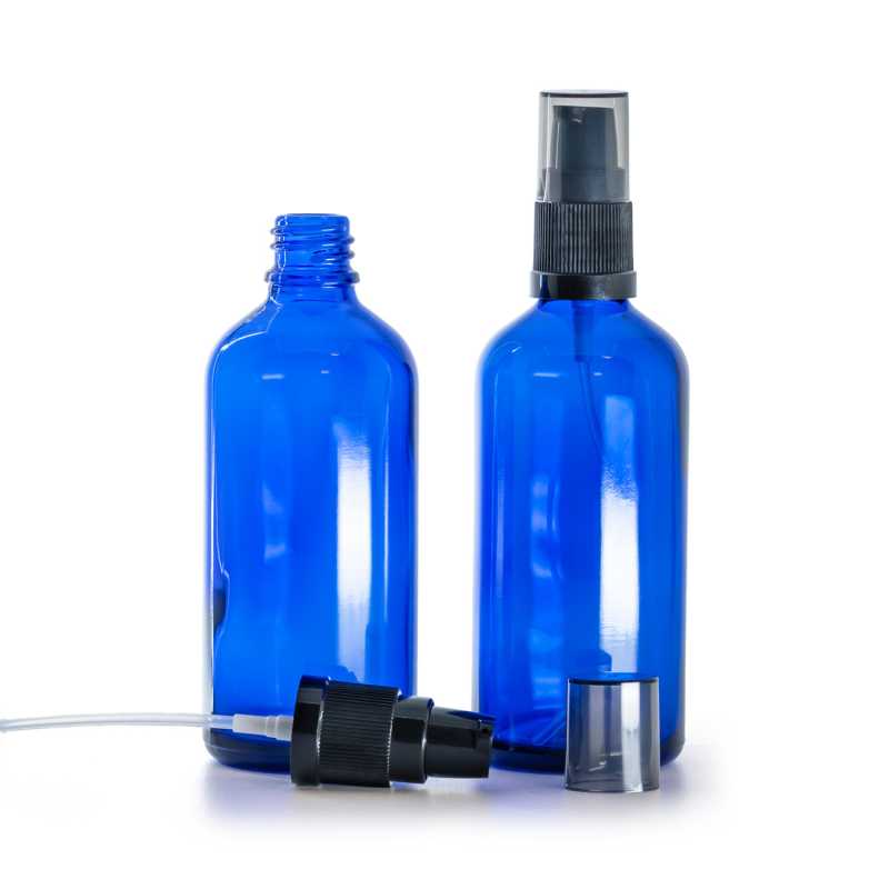 Kék üvegpalack krémpumpával és füstös kupakkal, 100 ml