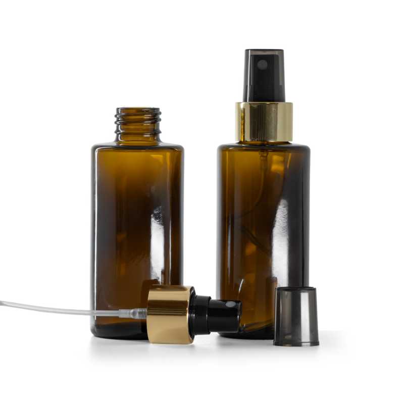 Borostyánszínű üvegpalack, egyenes nyak, 24 mm, fekete permetezőfej fényes arany gyűrűvel, 100 ml
